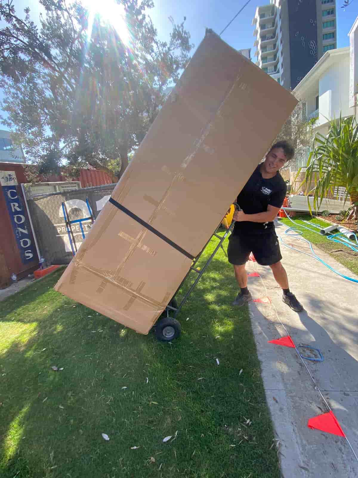 House removalists Gold Coast safely loading furniture into Will Move van