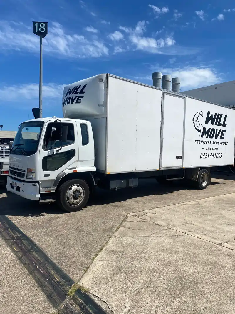 Furniture removalist Southport team from Will Move carefully loading furniture for a Gold Coast move